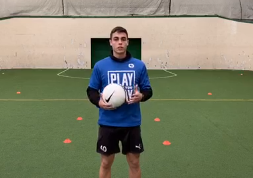 Image of coach with soccer ball